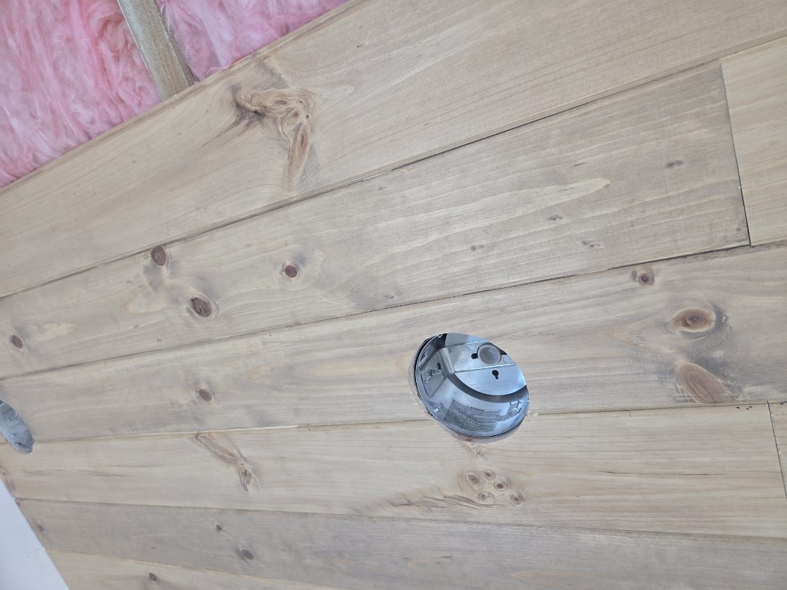 Tongue-and-groove wood wall paneling installed by A1M Construction