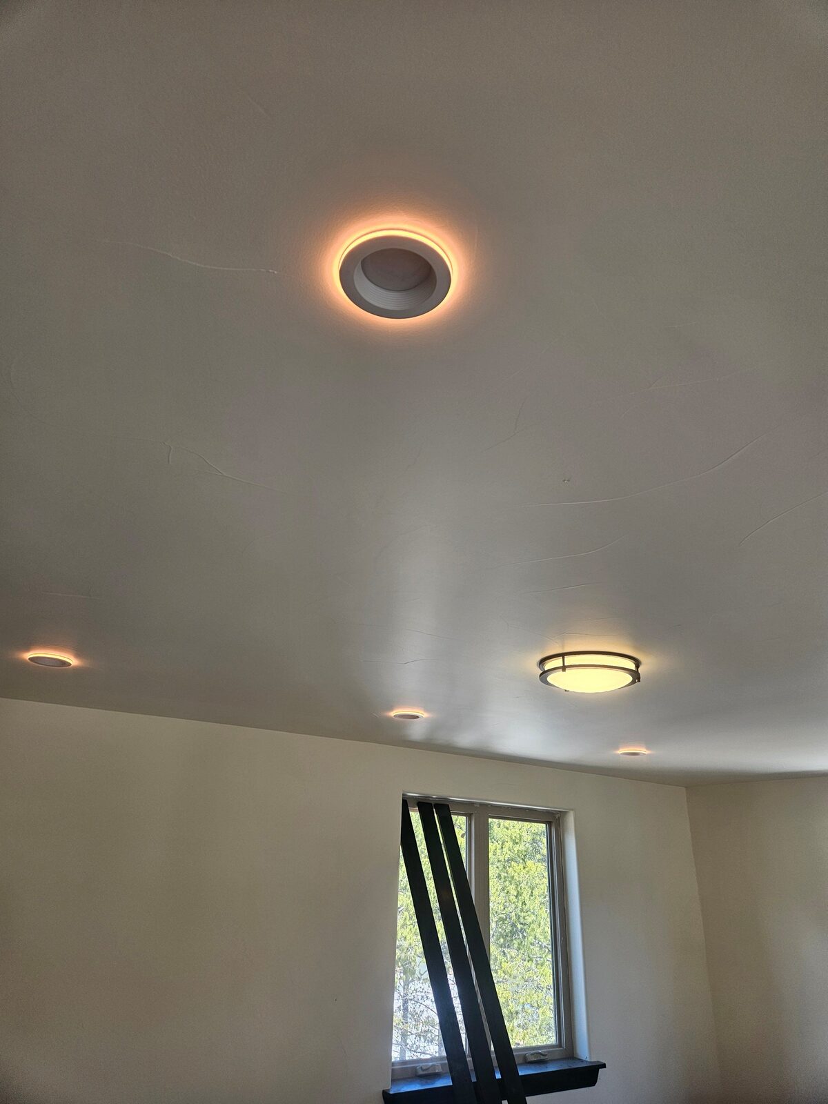 Finished ceiling with recessed halo lighting by A1M Construction